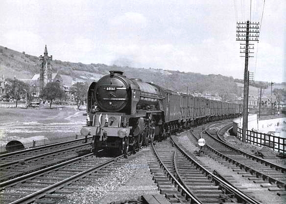 Steam hauled train crossing the Links